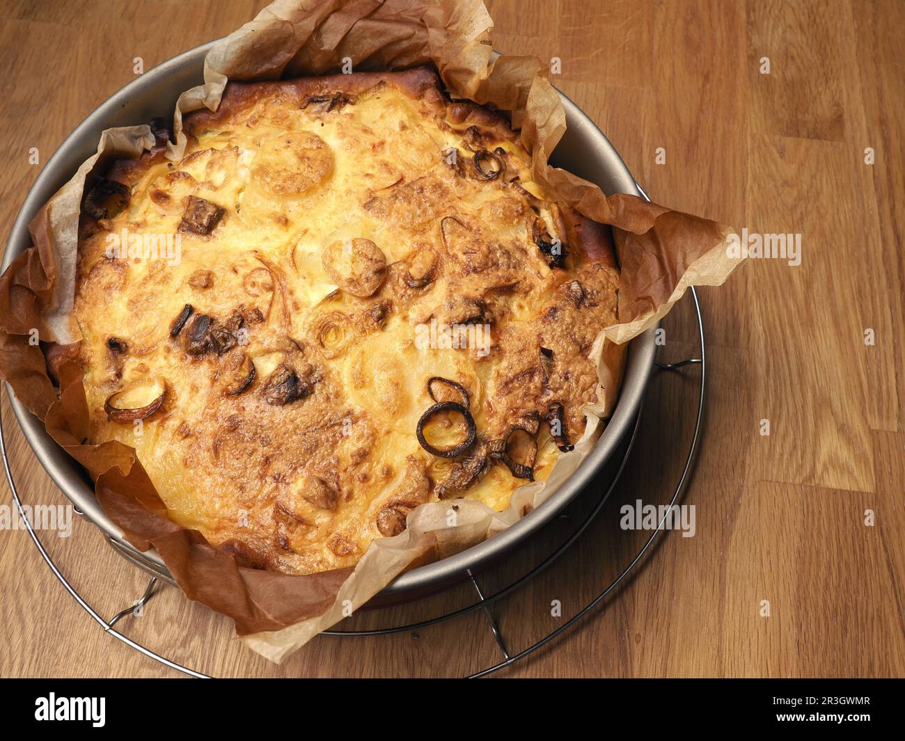 Quiche with potatoes and leeks in a springform pan, vegetarian food