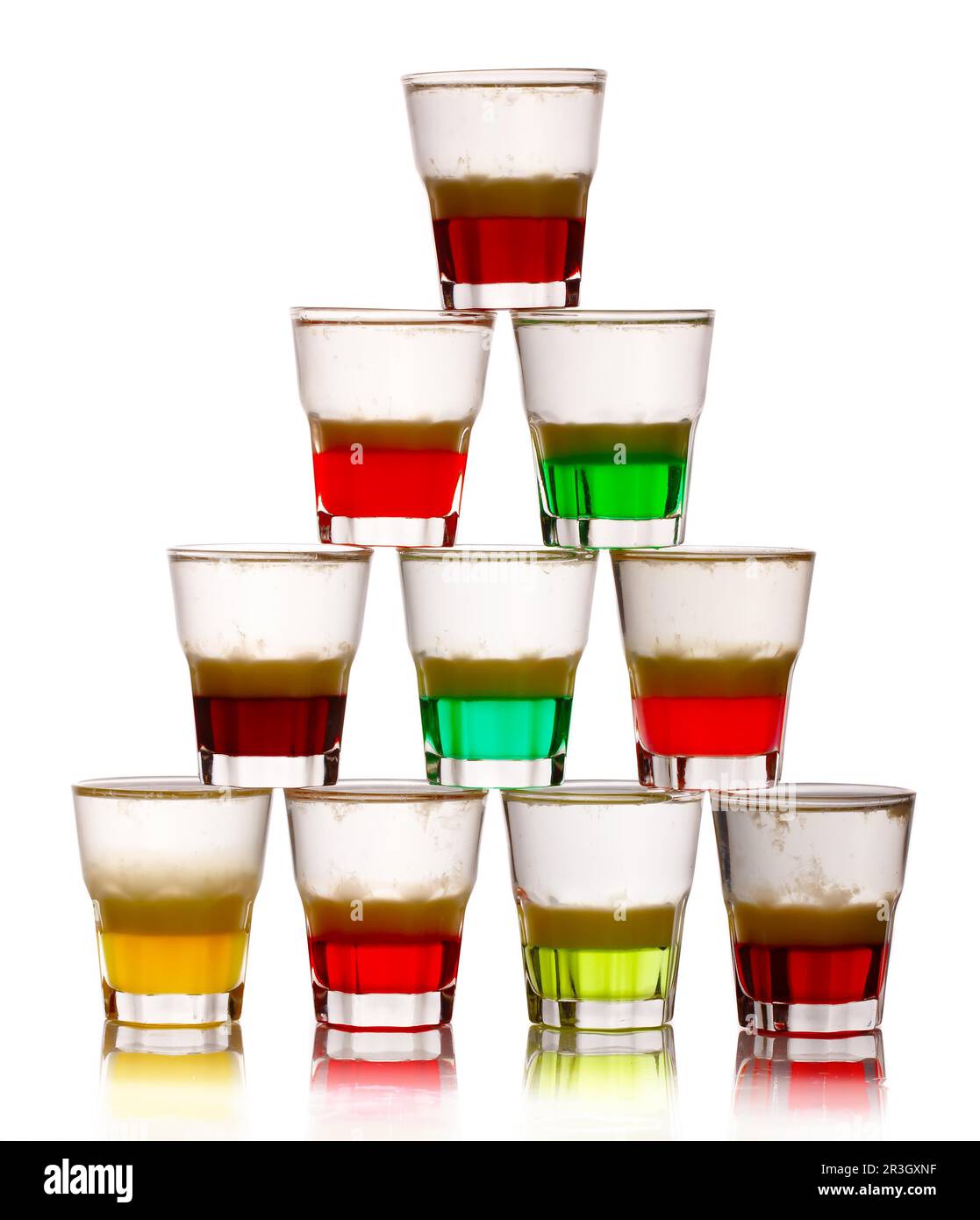 Pyramid of short colored alcohol cocktails isolated on white background Stock Photo