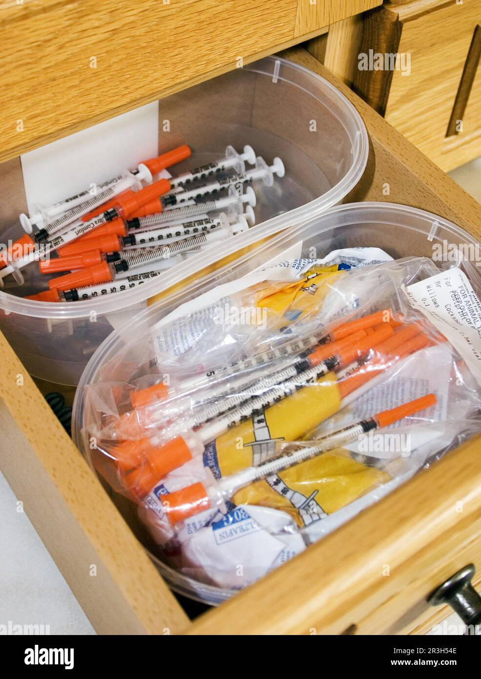 Drawer with insulin syringes for diabetic domestic cats, container with