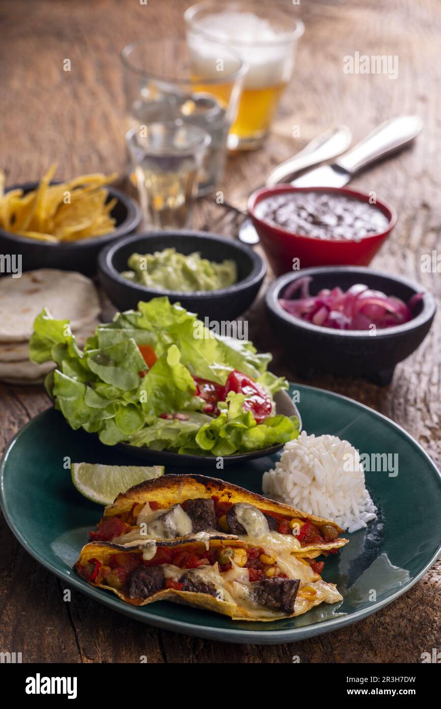 Mexican tacos on dark wood Stock Photo