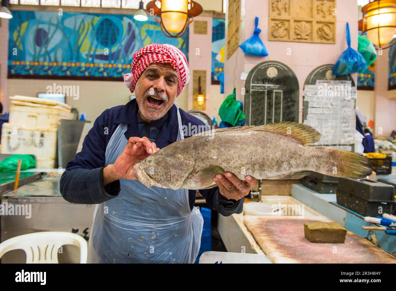 Local fisher man showing his fish, Fishing market, Kuwait City, Kuwait