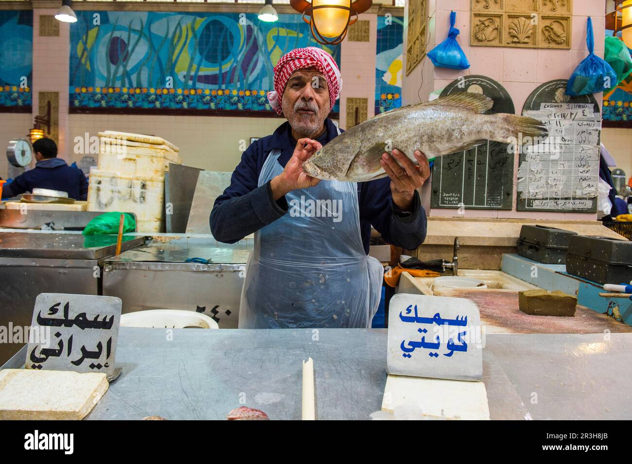 Local fisher man showing his fish, Fishing market, Kuwait City, Kuwait Stock Photo