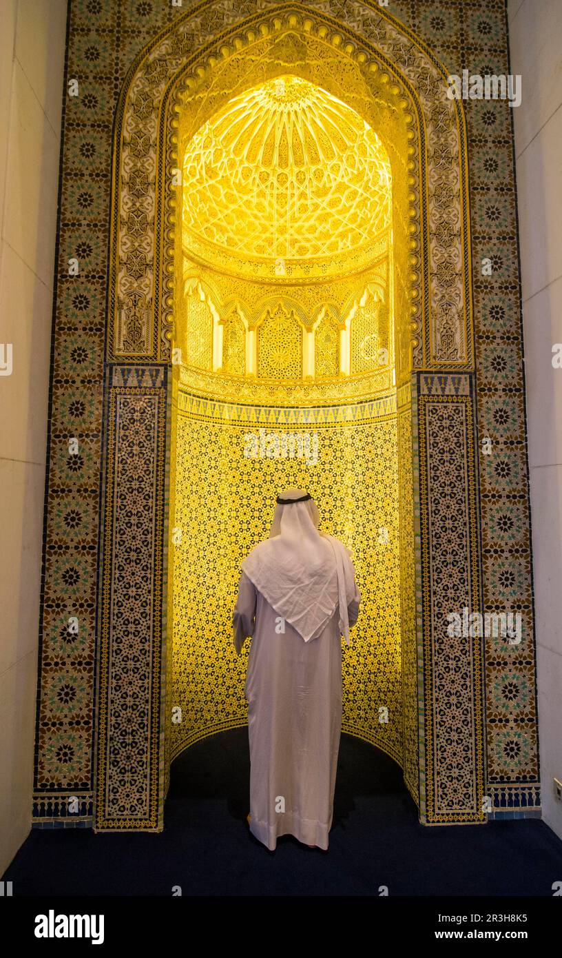 Imam praying inside the Grand mosque, Kuwait City, Kuwait Stock Photo