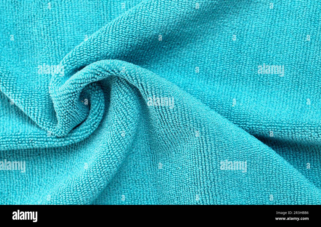 Wrinkled blue microfiber cloth texture of microfiber towel closeup
