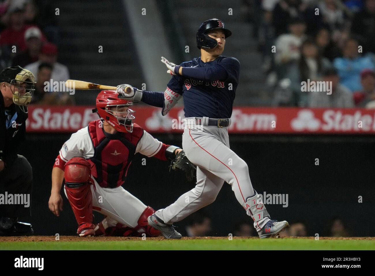 Boston Red Sox's Masataka Yoshida (7) follows through on a swings ...