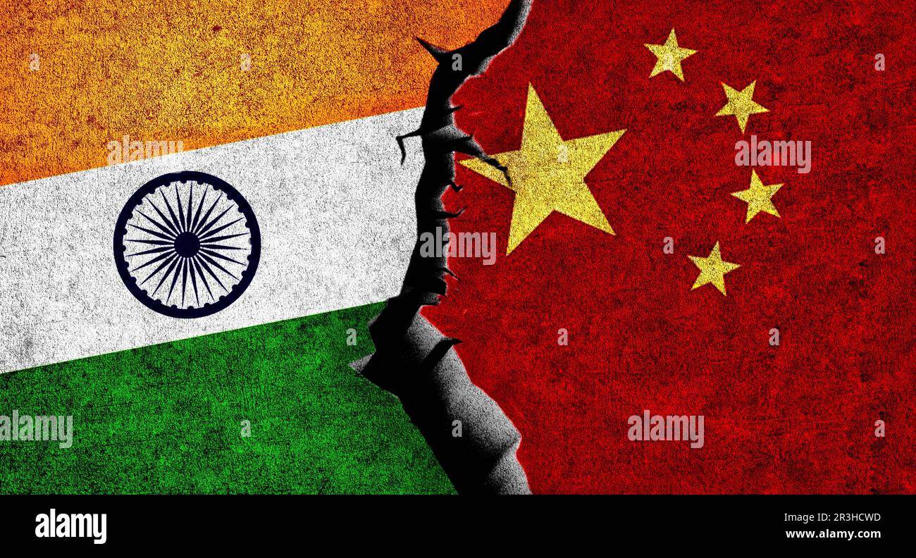Flag of China and India on wall with crack. China India conflict Stock Photo
