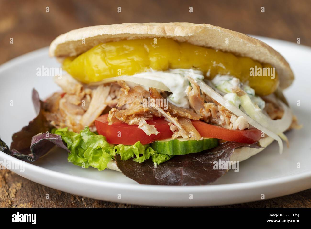 Close-up of a fresh kebab in a bread roll Stock Photo