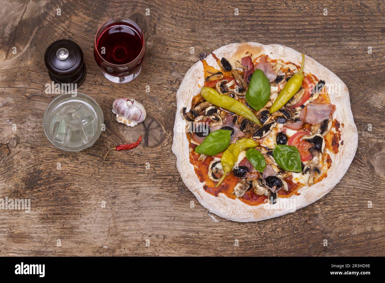 Supervision of a pizza on wood Stock Photo