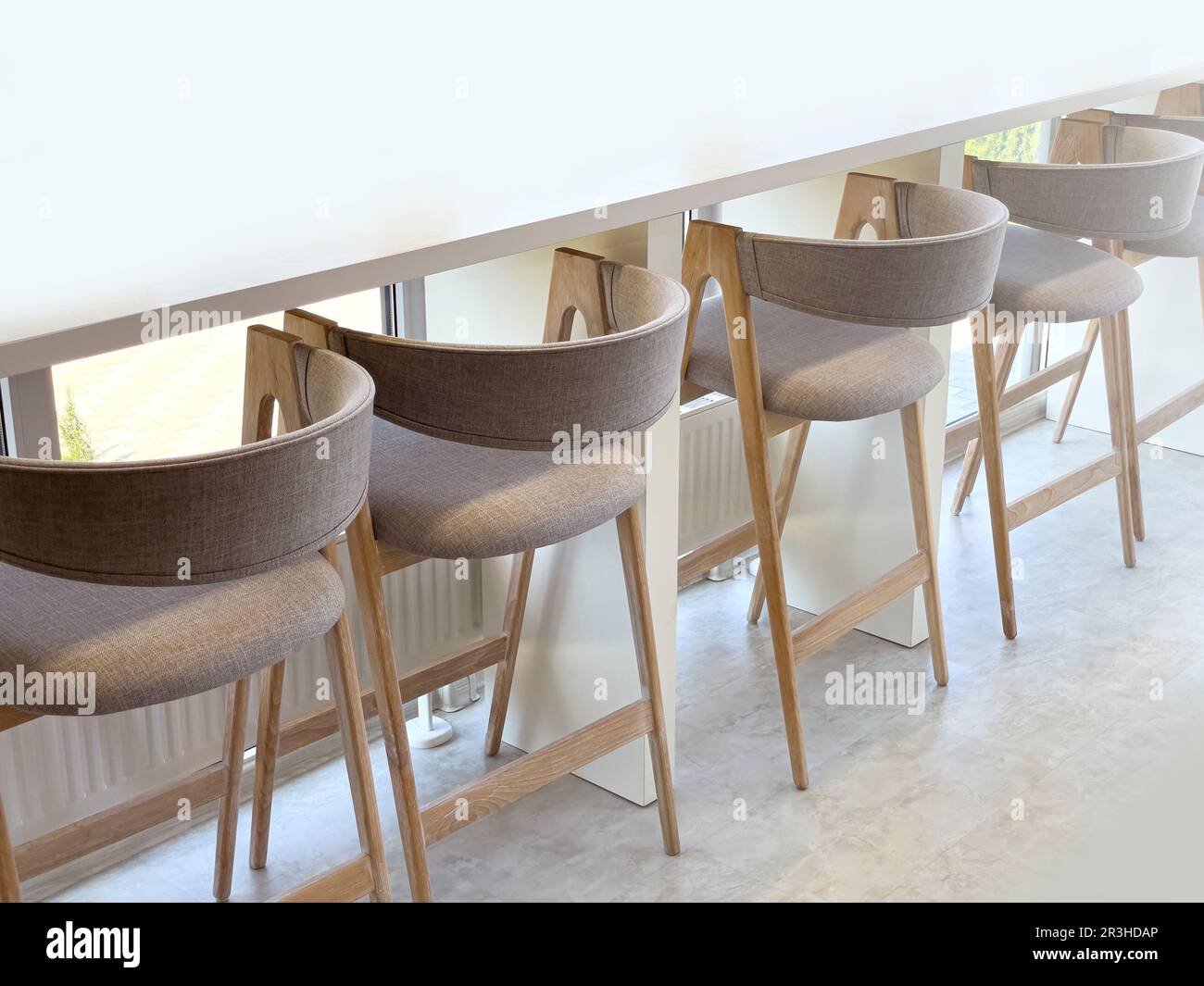 chairs in a row with a bar counter.Modern interior design of a cafe