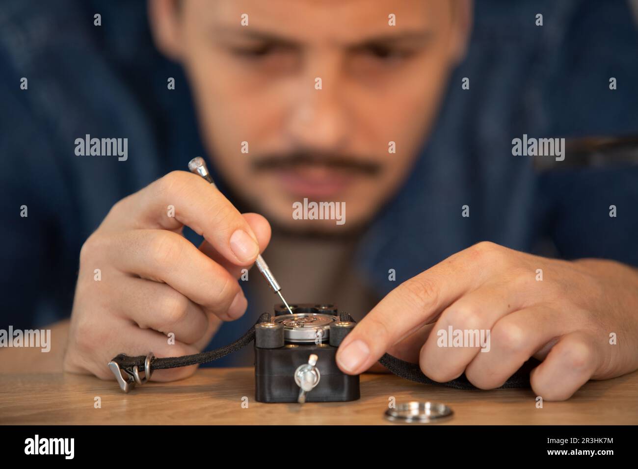 senior watchmaker repairing an old pocket watch Stock Photo Alamy