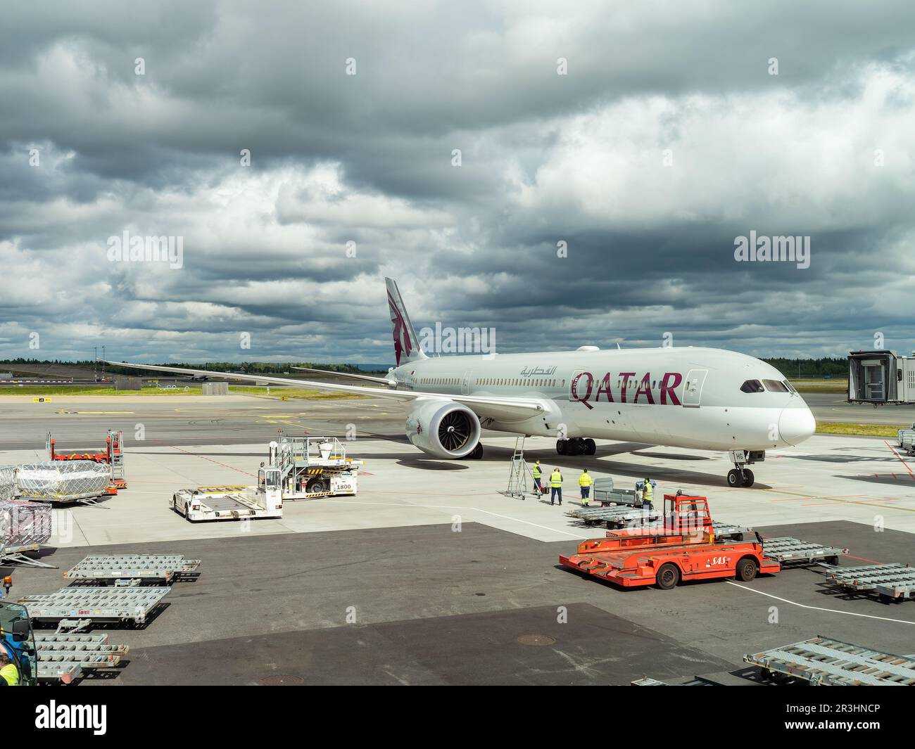 Gardermoen, Norway - August 22, 2022: Qatar Airways Boeing 787-9 arriving at a gate of Oslo Airport, Gardermoen. Stock Photo
