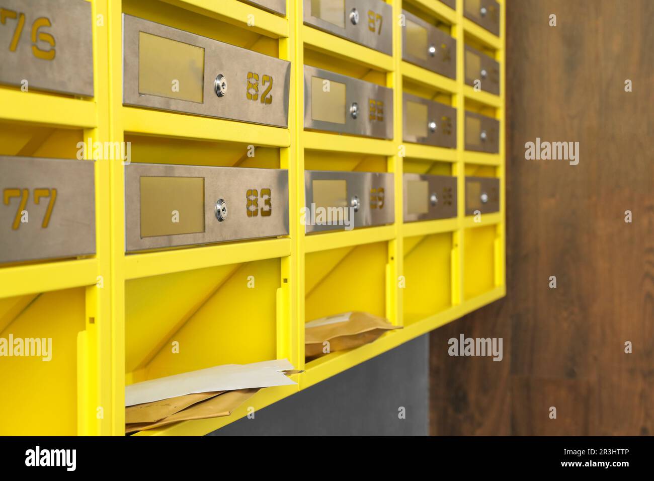 Metal mailboxes with keyholes, numbers and correspondence in post