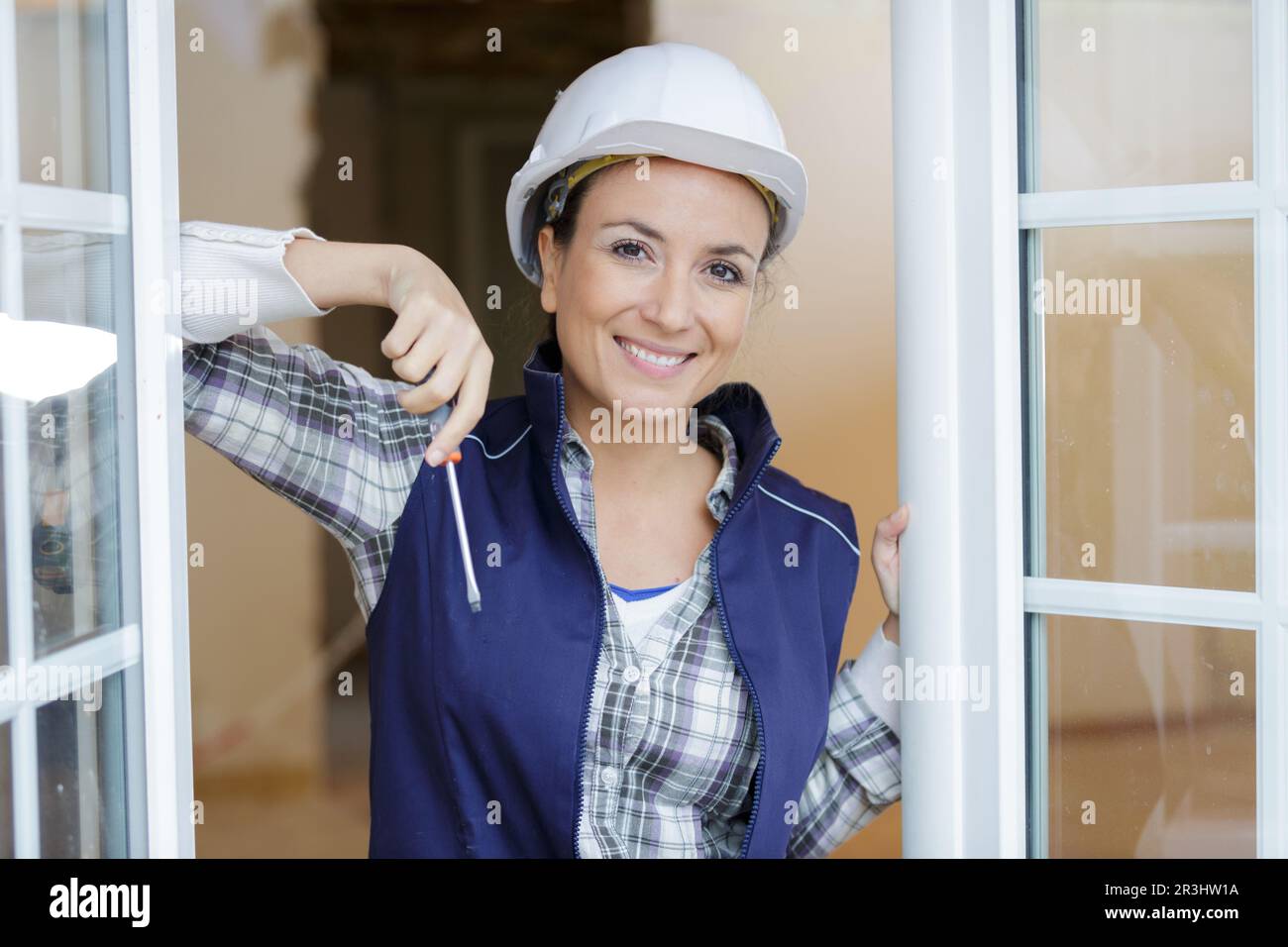 happy woman fixing a window Stock Photo - Alamy