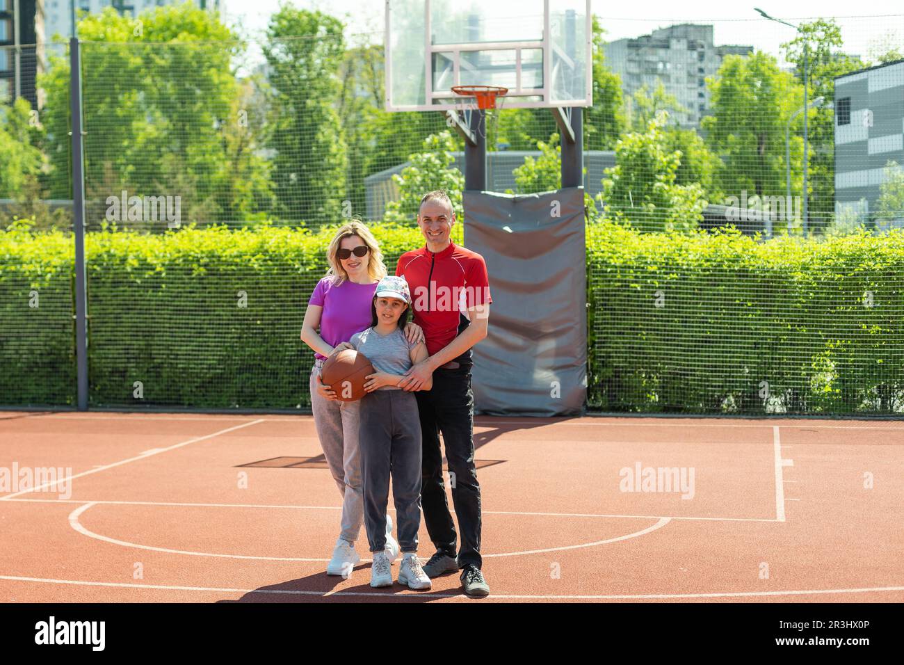 Caucasian family playing basketball together Stock Photo - Alamy