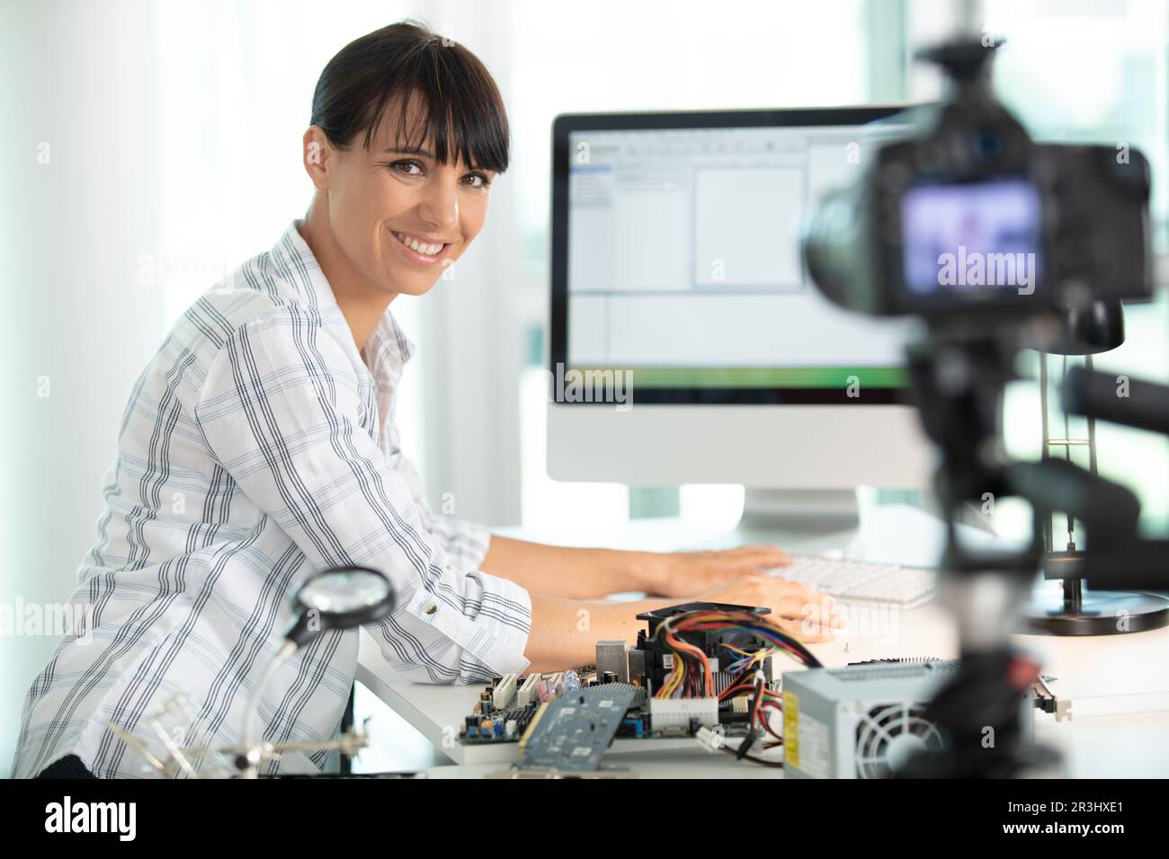 happy female bloger during engineering blog Stock Photo - Alamy