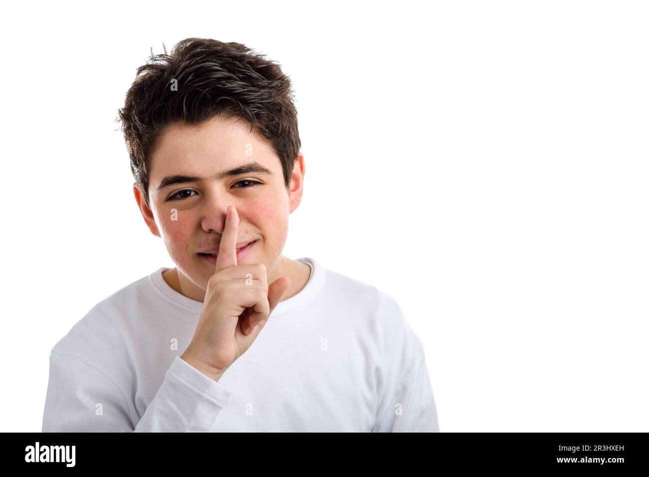 Be silent gesture by Caucasian teenager with acne skin Stock Photo