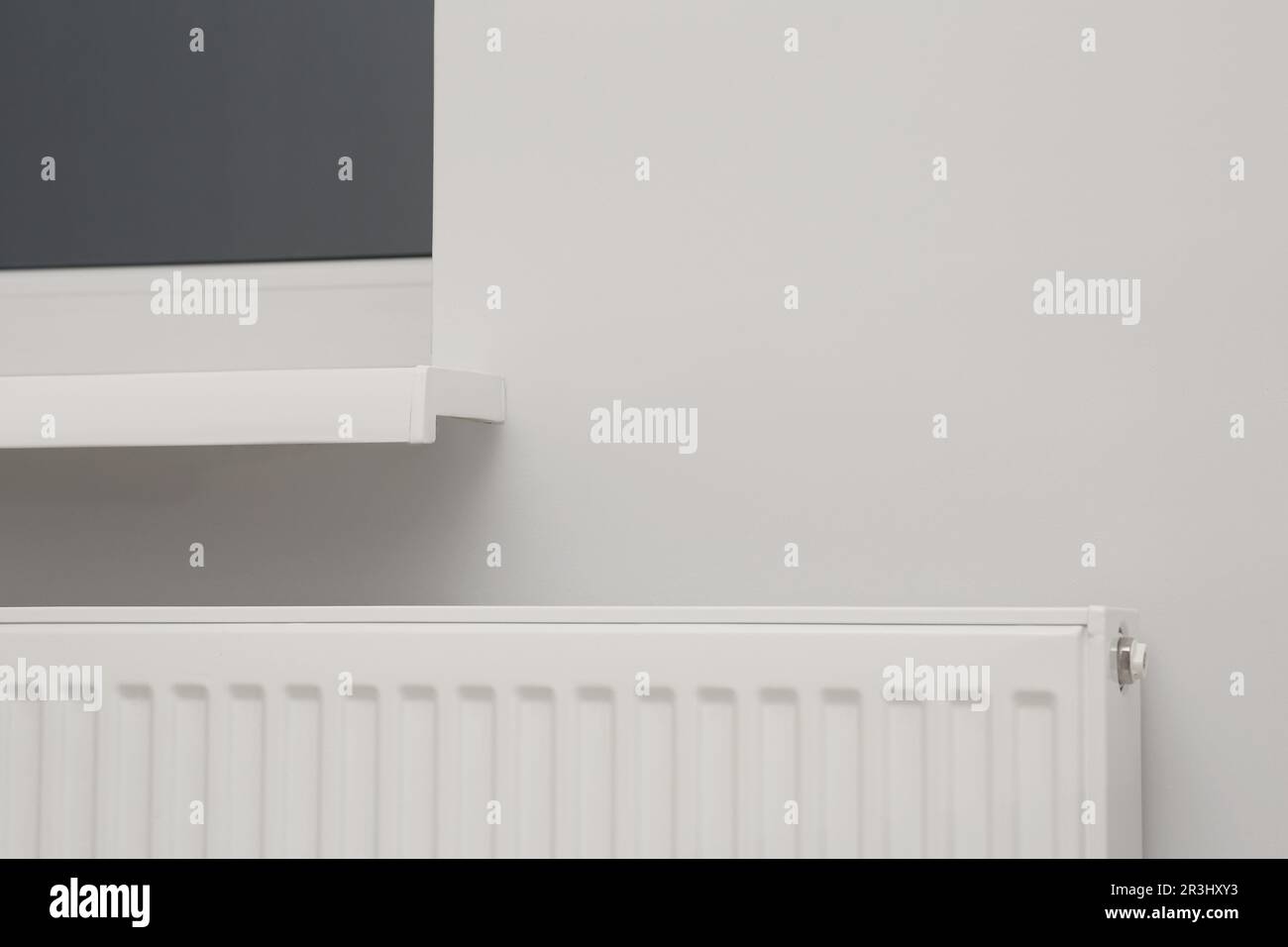 Modern panel radiator under window indoors. Heating system Stock Photo Alamy