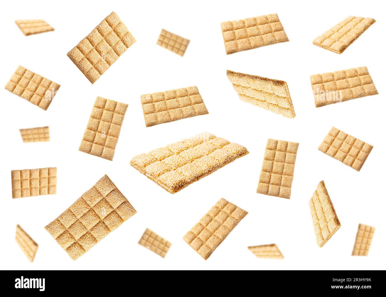 Delicious sesame kozinaki bars falling on white background Stock Photo