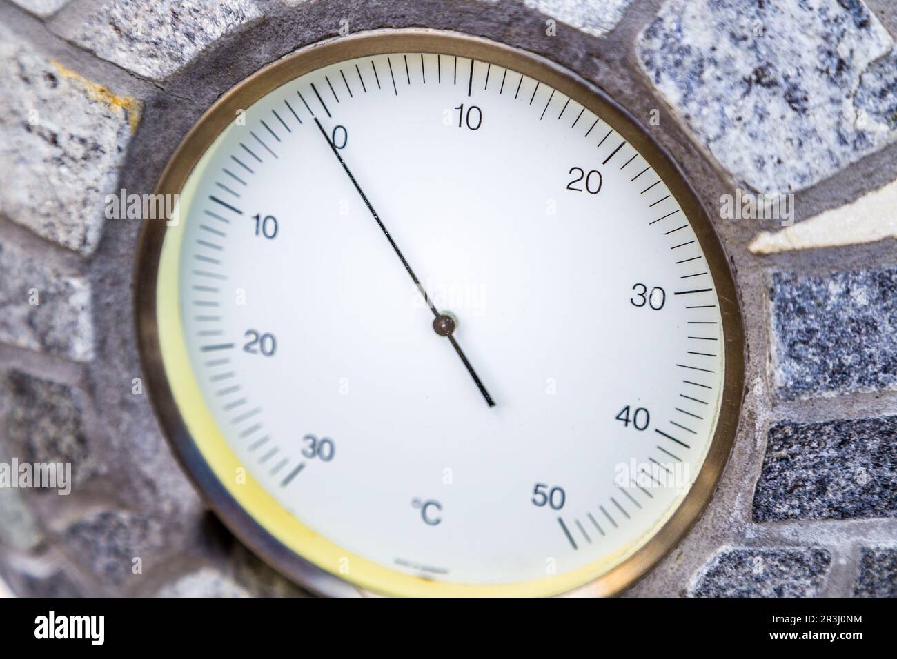 Below zero Celsius according to analog thermometer Stock Photo