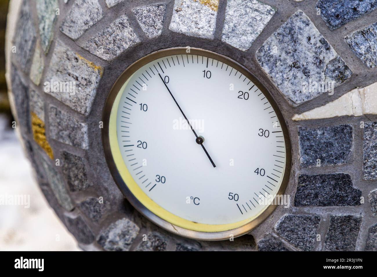 Below zero Celsius according to analog thermometer Stock Photo