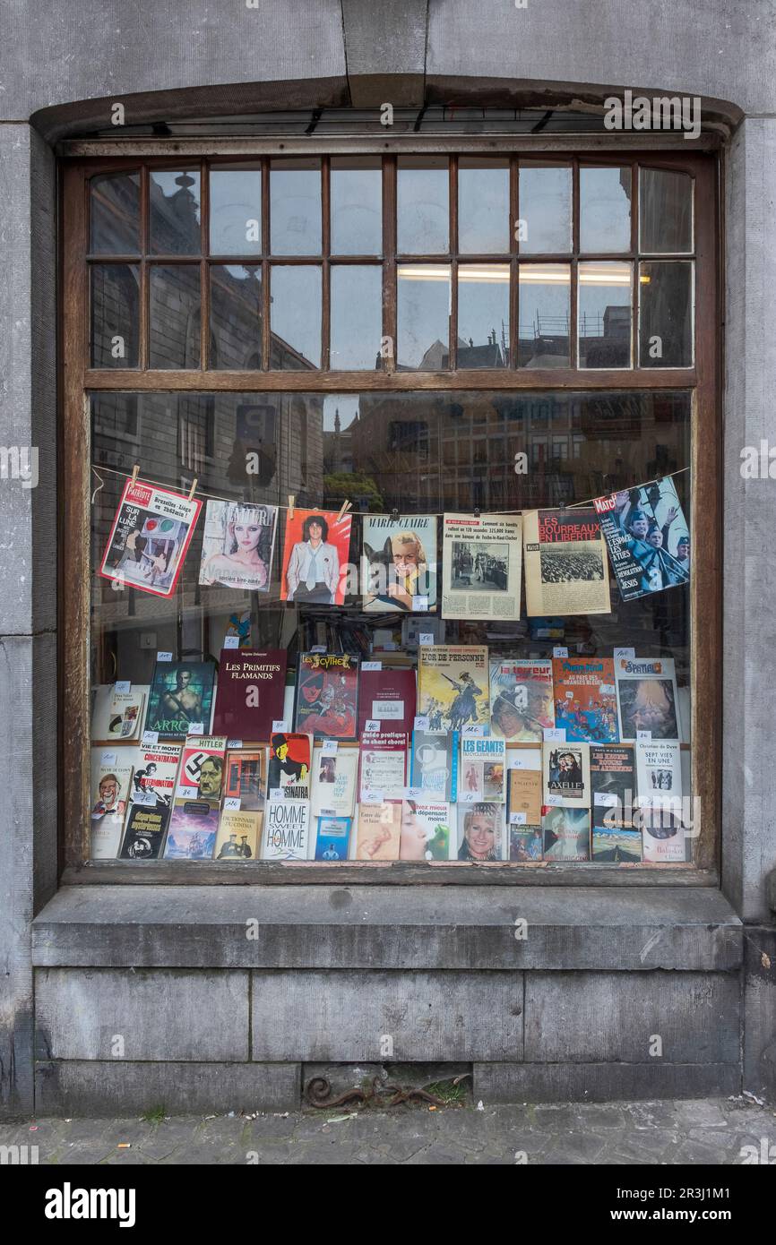 Antiquarian bookshop in Liege. Shop window with old magazines Stock Photo