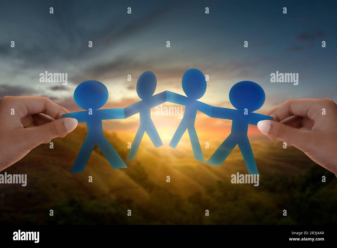 human-hand-showing-paper-people-are-holding-hands-symbol-of-friendship