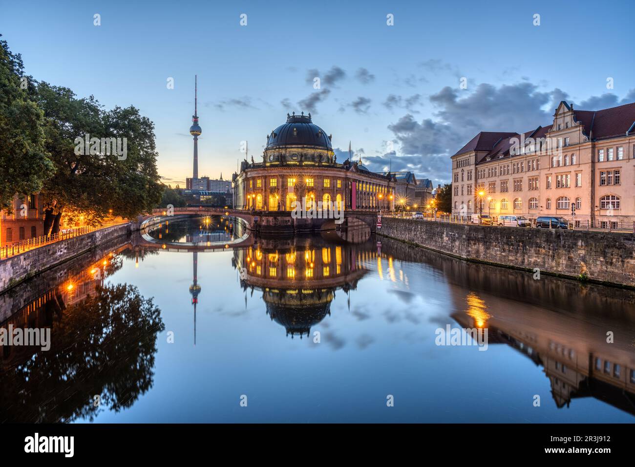 The Bode-Museum and the Television Tower reflected in the river Spree in Berlin before sunrise Stock Photo