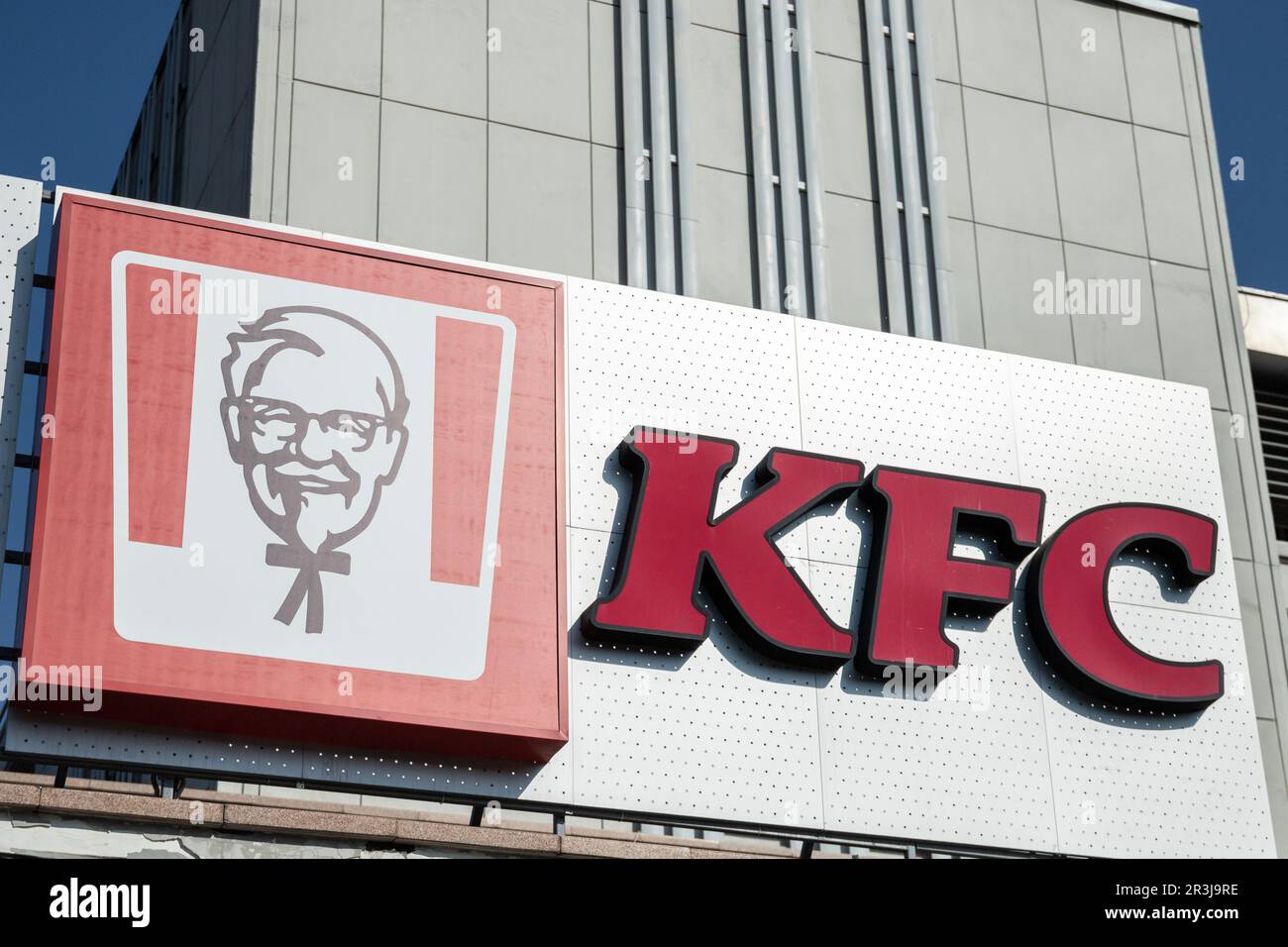 A sign of the fast food brand KFC on a building in Almaty Stock Photo ...