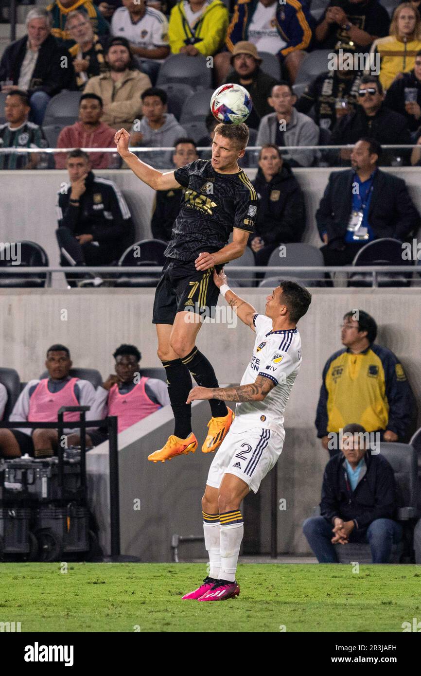 LAFC forward Stipe Biuk (7) wins a header against Los Angeles Galaxy defender Lucas Calegari (2) during a Lamar Hunt U.S. Open Cup round of 16 match, Stock Photo