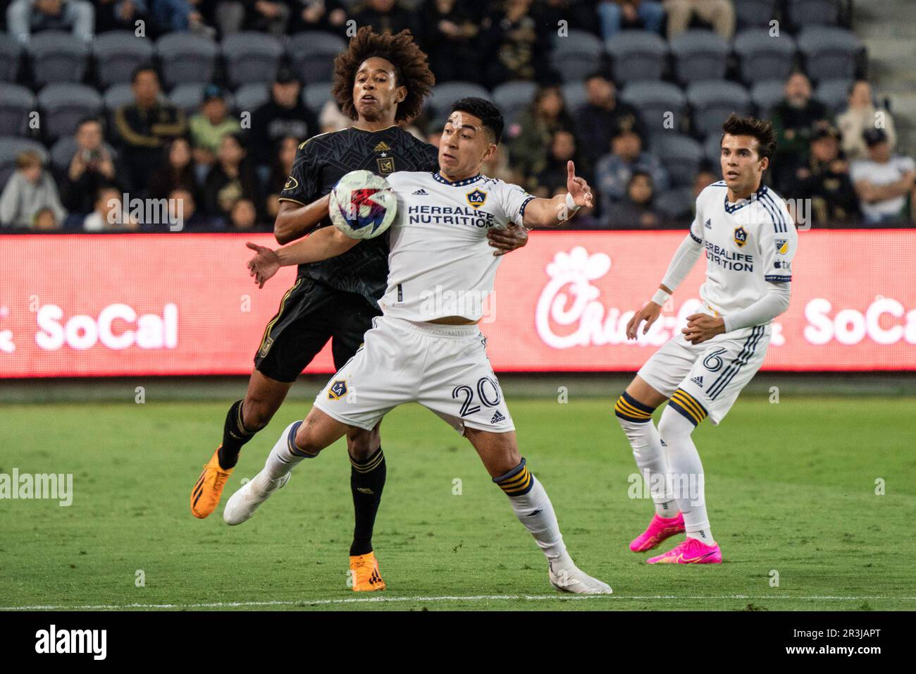 Los Angeles Galaxy midfielder Memo Rodríguez (20) and LAFC defender Julian Gaines (80) battle for possession during a Lamar Hunt U.S. Open Cup round o Stock Photo