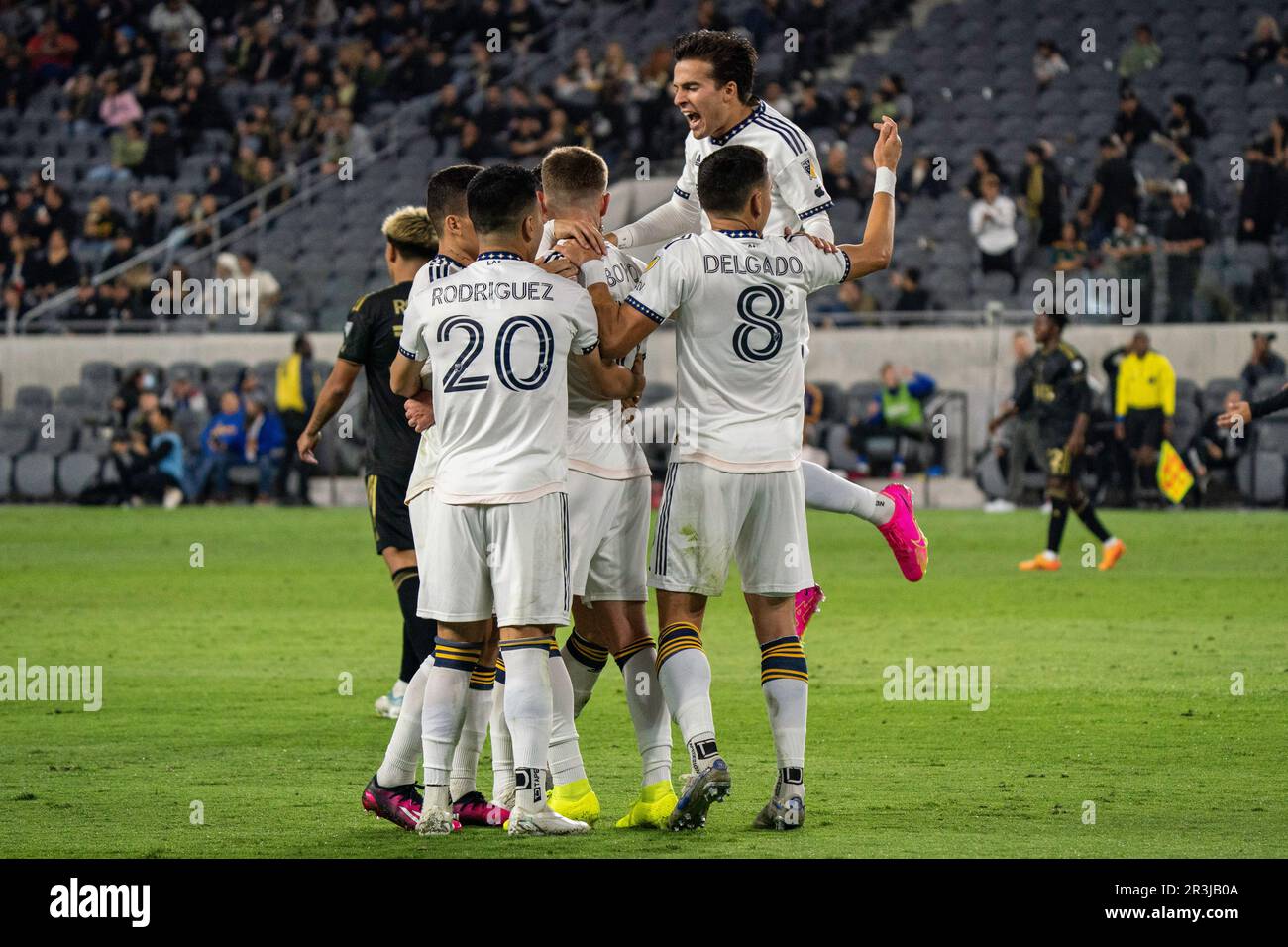 Los Angeles Galaxy midfielder Memo Rodríguez (20), midfielder Marco Delgado (8), midfielder Riqui Puig (6) and midfielder Tyler Boyd (11) celebrate a Stock Photo