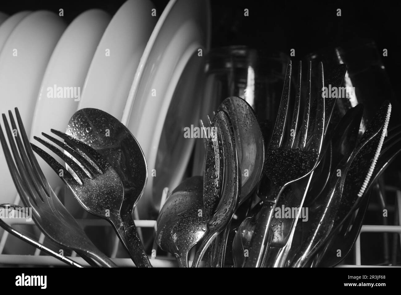 Clean wet plates and cutlery in dishwasher, closeup Stock Photo Alamy