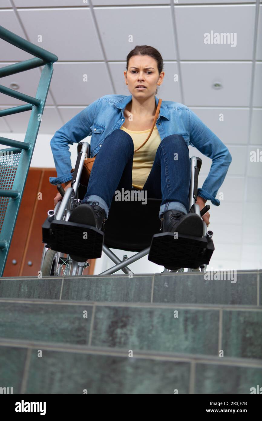 young person in a wheelchair in front of a stair Stock Photo Alamy