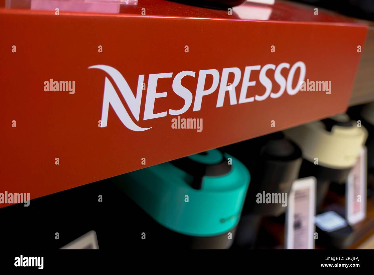 April 2023 Milan, Italy: Nespresso logo icon closeup in th electronic store. Nespresso coffee machine closeup Stock Photo