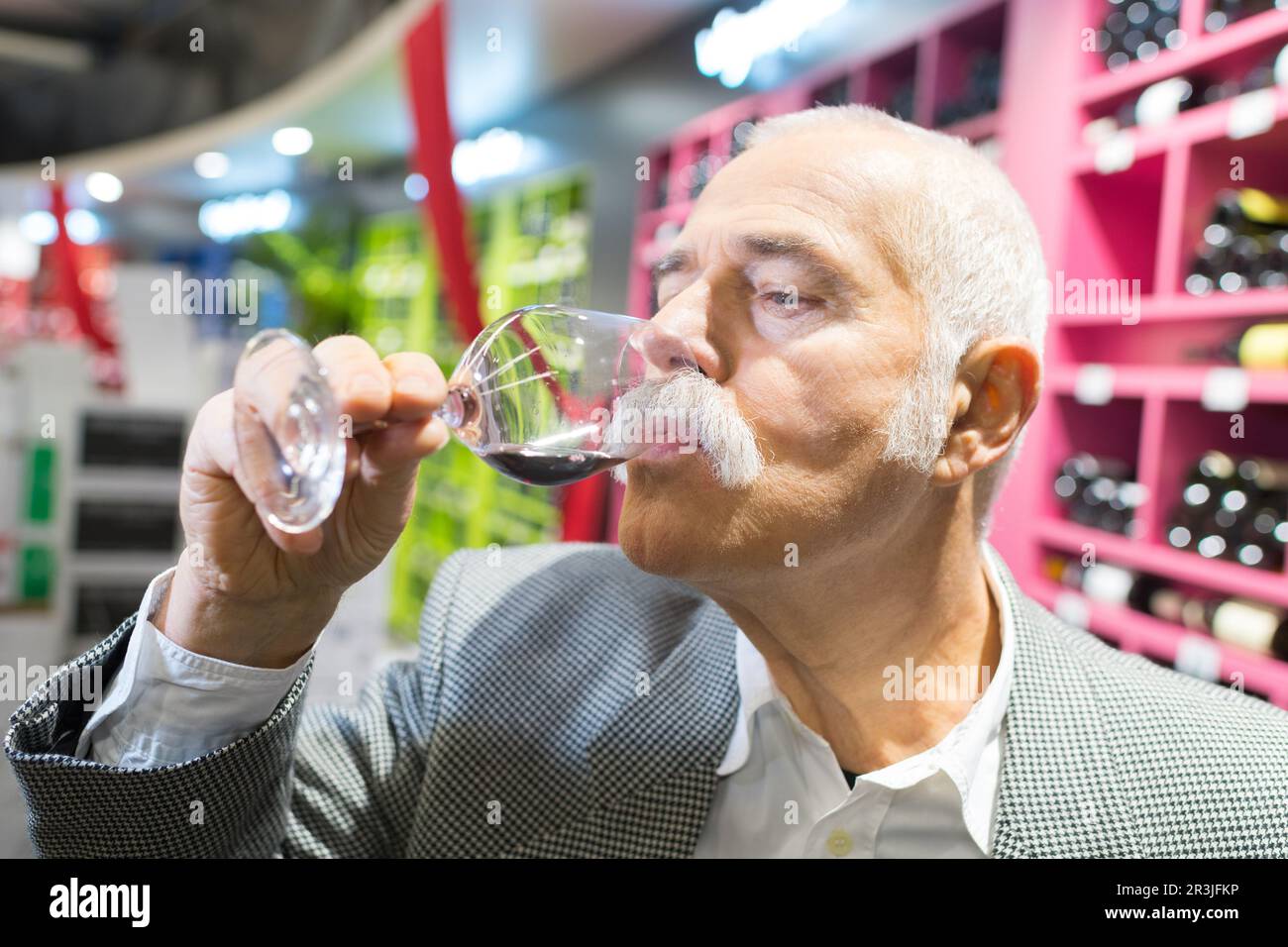 man tasting the free wine Stock Photo - Alamy