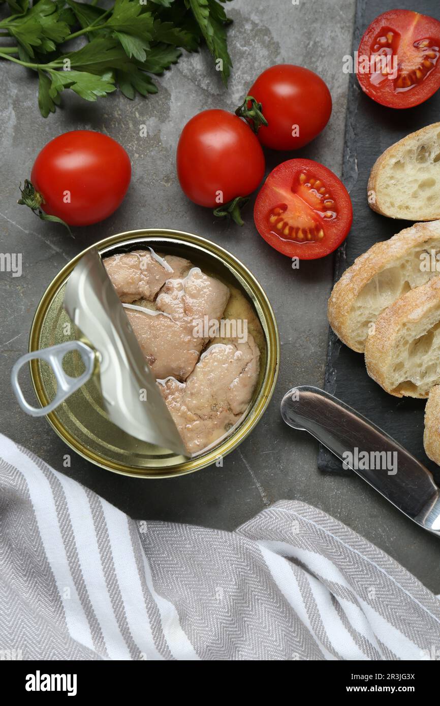 Flat lay composition with tin can of tasty cod liver and different ...