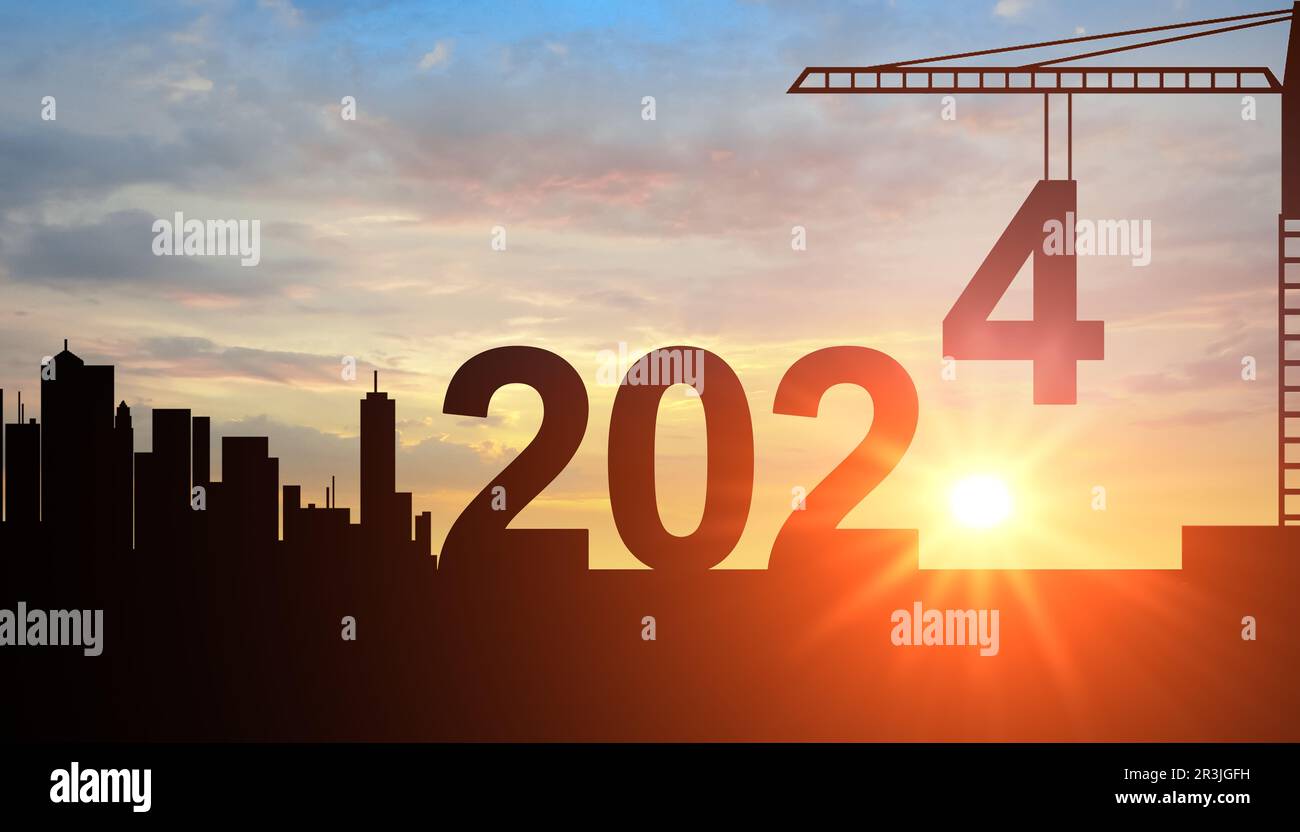2024. New Year 2024. Silhouette of Construction crane and sunset sky