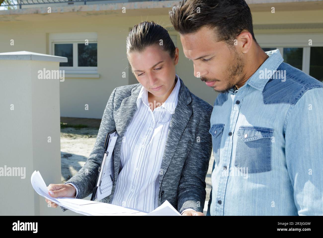 man and woman engineers work on plans construction Stock Photo