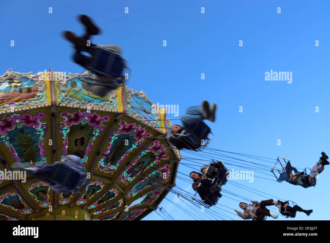 Chain carousel and Ferris wheel on the Hamburg Cathedral Stock Photo ...