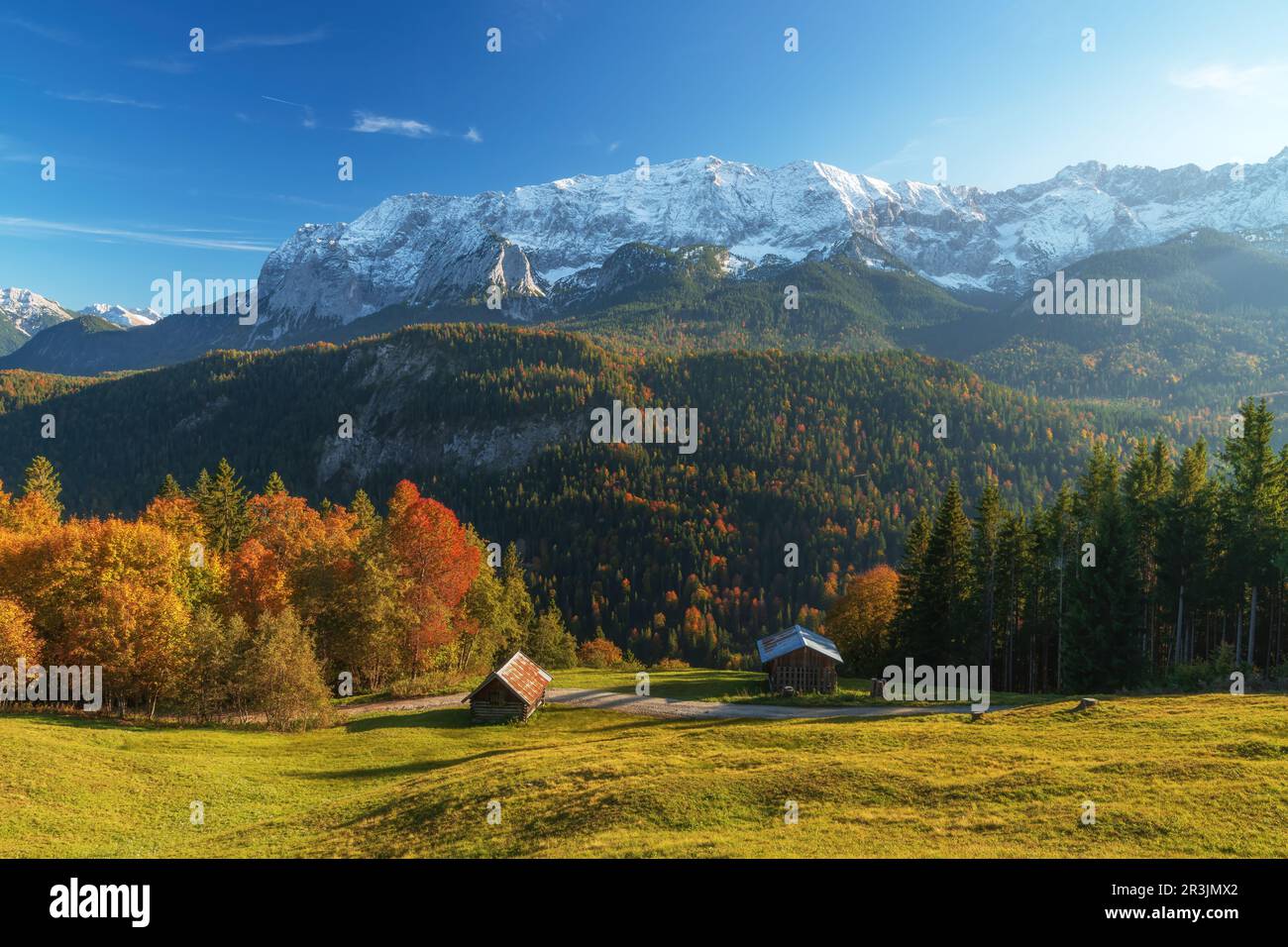 Fall colors and snow on the mountain peak near garmisch partenkirchen. Taken from Mountain Eckbauer. Stock Photo