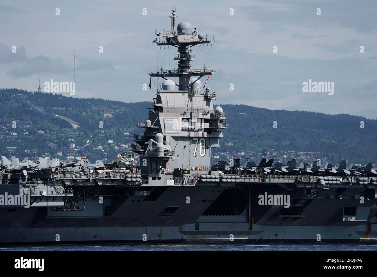 Nesodden 20230524.The American aircraft carrier USS Gerald R. Ford on its way into the Oslofjord, here at Nesoddtangen. The ship is the world's largest warship and will be in port in Oslo for four days. Photo: Stian Lysberg Solum / NTB Stock Photo
