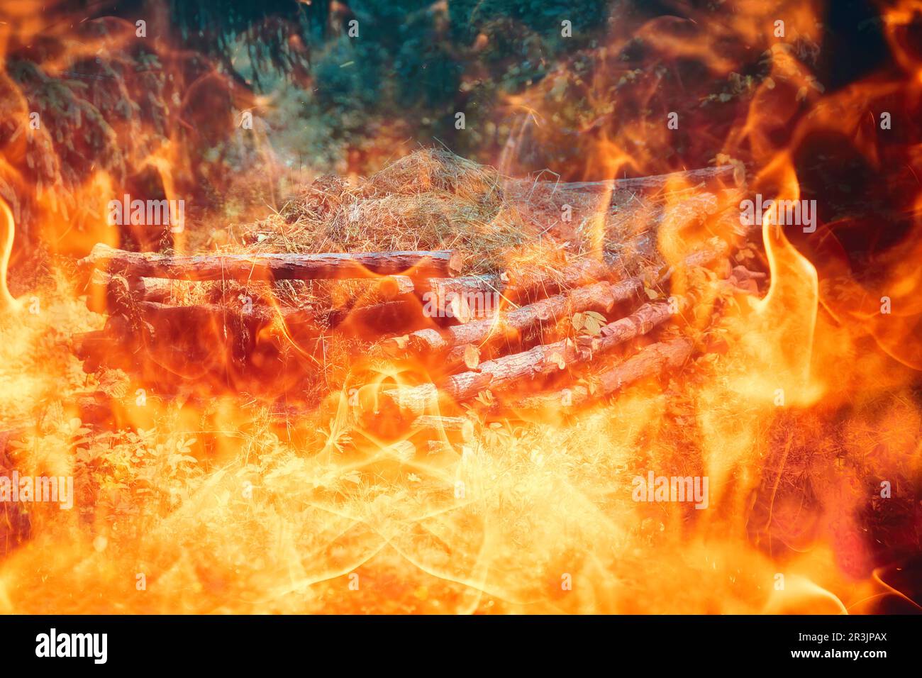 beautiful natural compost heap in woodland permaculture garden. Fire