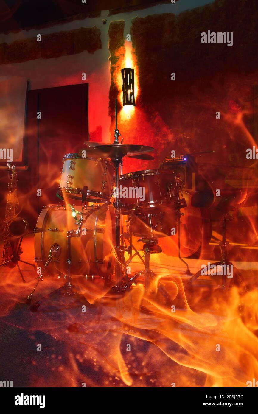 Drums and saxophone in pub. Fire effect Stock Photo Alamy