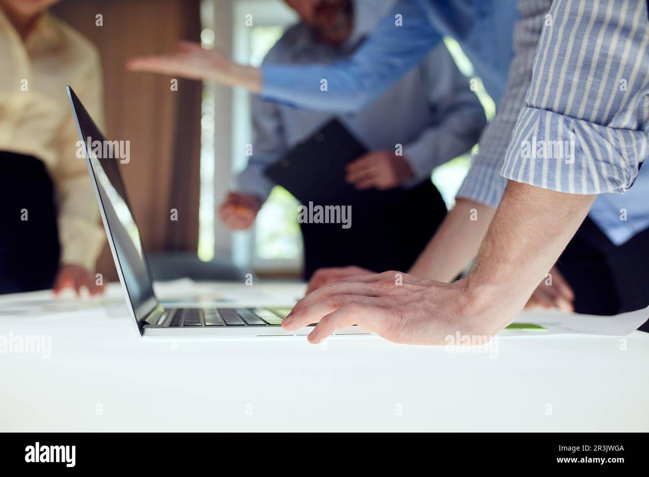 Team of developers creating new Website design, working on software over modern office design interior. IT company. Concept of coding technologies Stock Photo