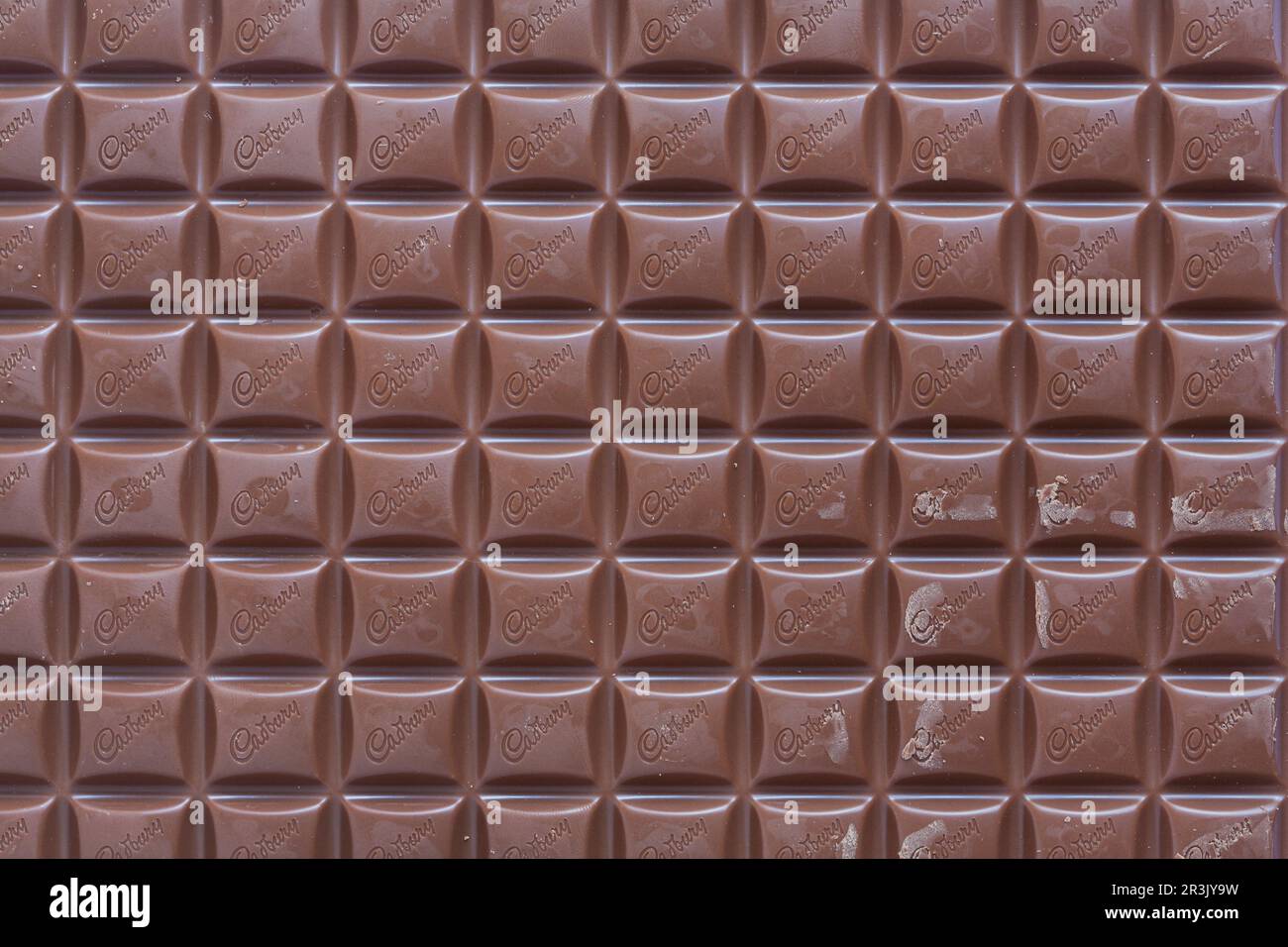 Bar of Cadbury's Dairy Milk milk chocolate bar unwrapped Stock Photo Alamy