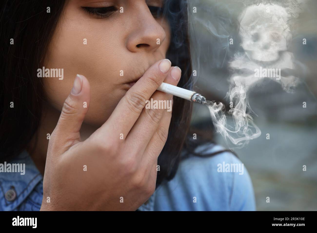 No Smoking. Woman with cigarette outdoors, closeup. Skull and
