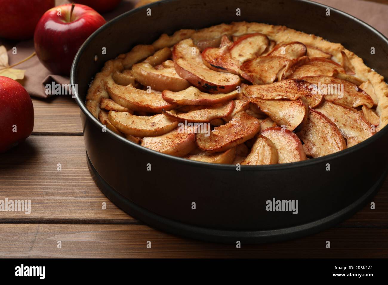 Delicious apple pie and fresh fruits on wooden table, closeup Stock Photo