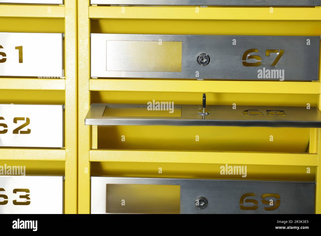 Open metal mailbox with key and numbers Stock Photo