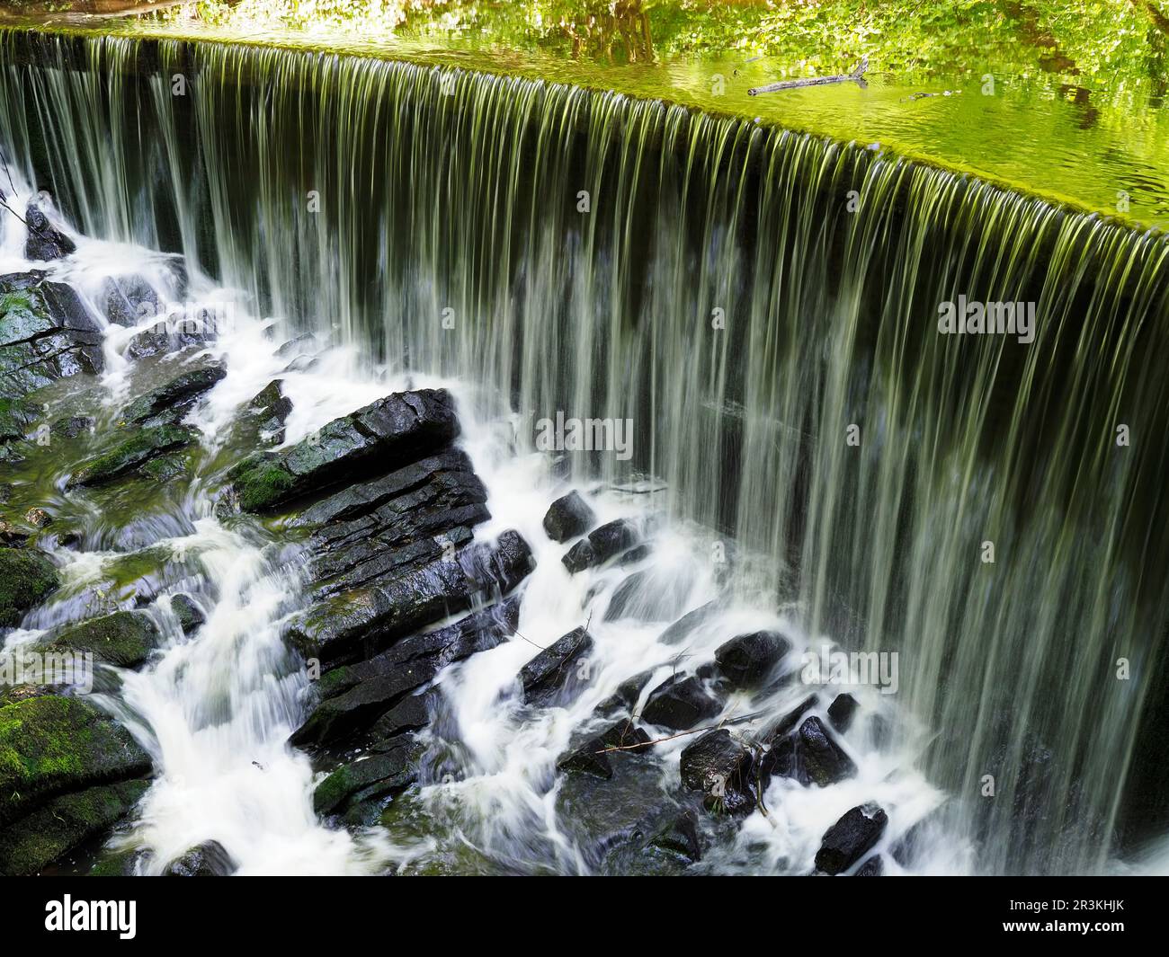 Weir at Long Dam in Skipton Castle Woods Skipton North Yorkshire England Stock Photo