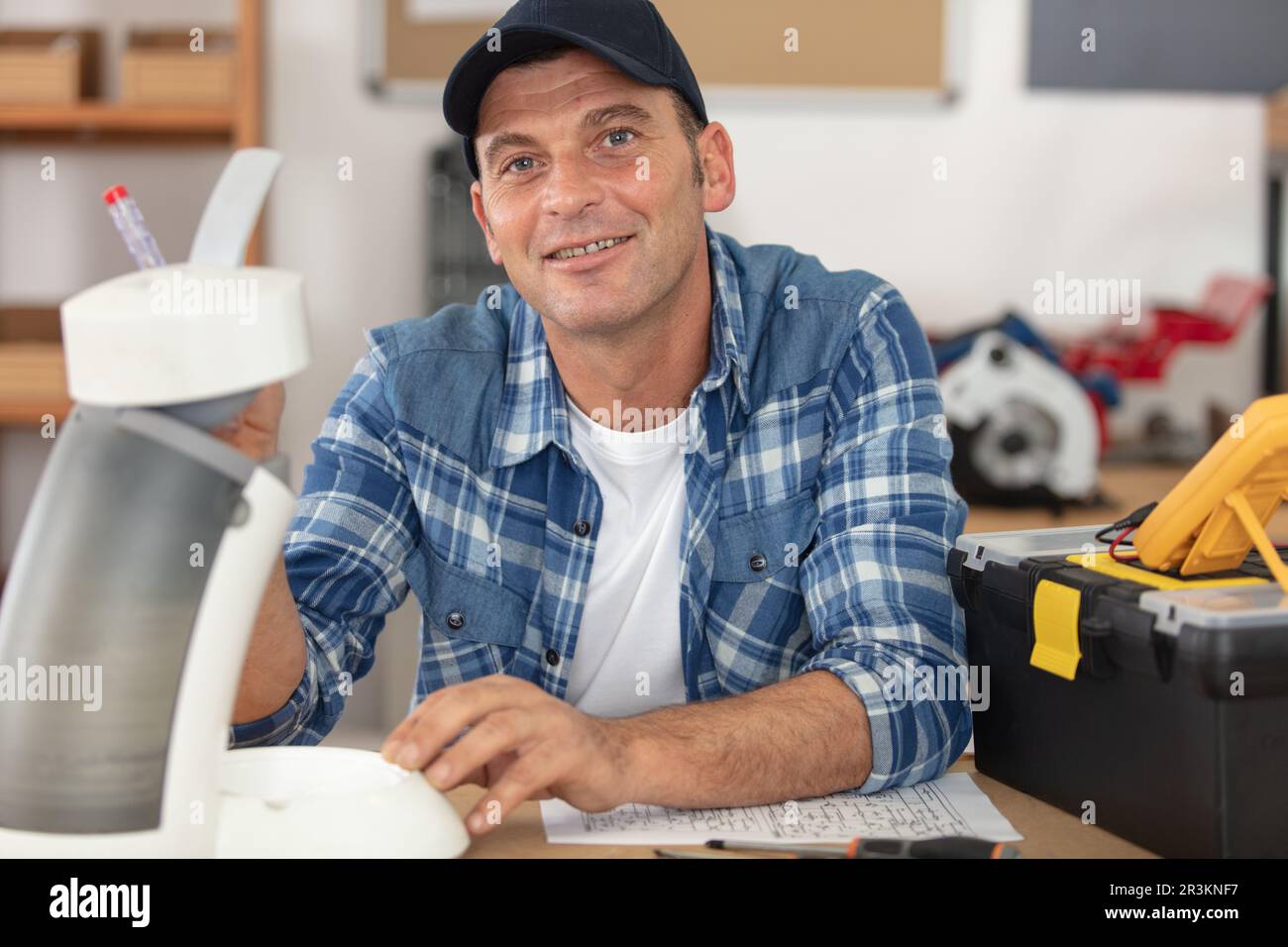 professional worker is fixing coffee machine Stock Photo